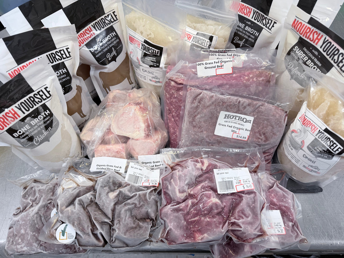 A bulk assortment of packaged meats and bone broths, plus bones.