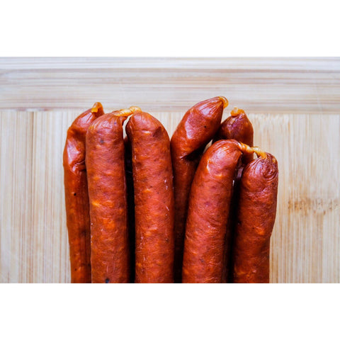 Dried pepperoni sausages in a bunch